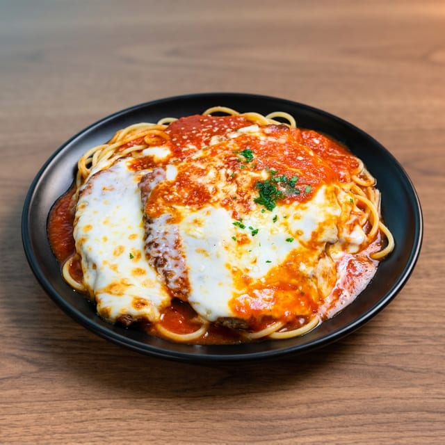 Eggplant Parmigiana With Spaghetti.